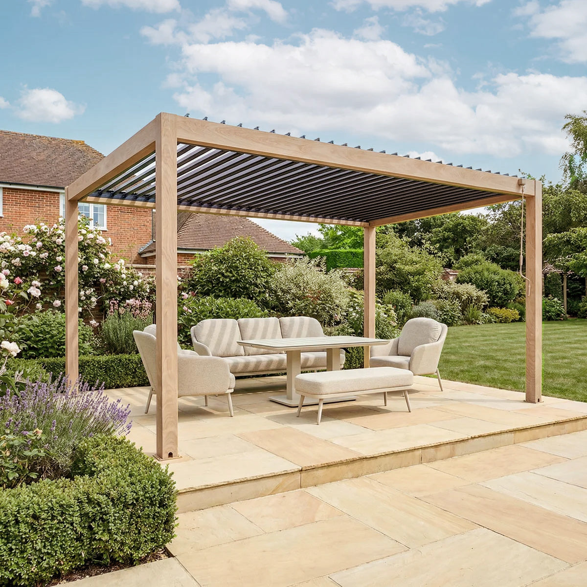 PergoSTET Plus Frame Only 3m x 4m Rectangular Pergola with LED Lighting in Wood Effect—shown on a patio with outdoor furniture and lush gardens, features integrated drainage for all-weather comfort.